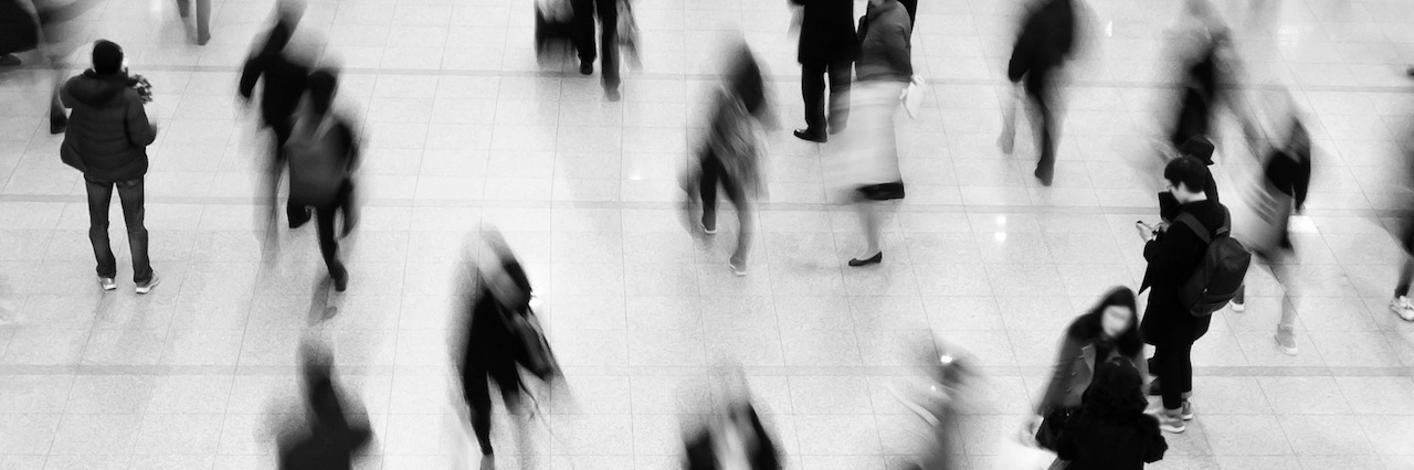 What It's Like to Have Anxiety in a Crowded Bus Station a crowd of people at a bus station