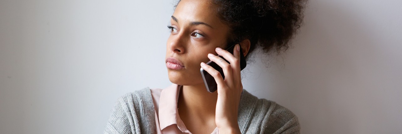 Reactions I Get When I Tell People About My Mental Illness Young woman talking on mobile phone