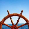 a steering wheel and the sea