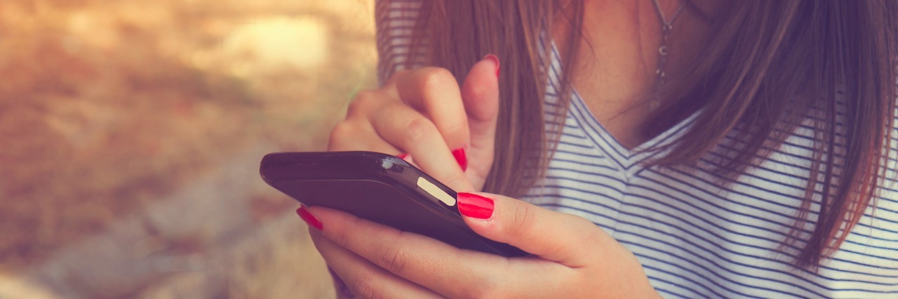 Election Anxiety: Why It's OK to Stop Watching the News woman on her phone