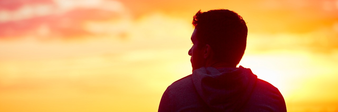 5 Positive Things I've Gained on My Journey With Depression man looking at the sunrise