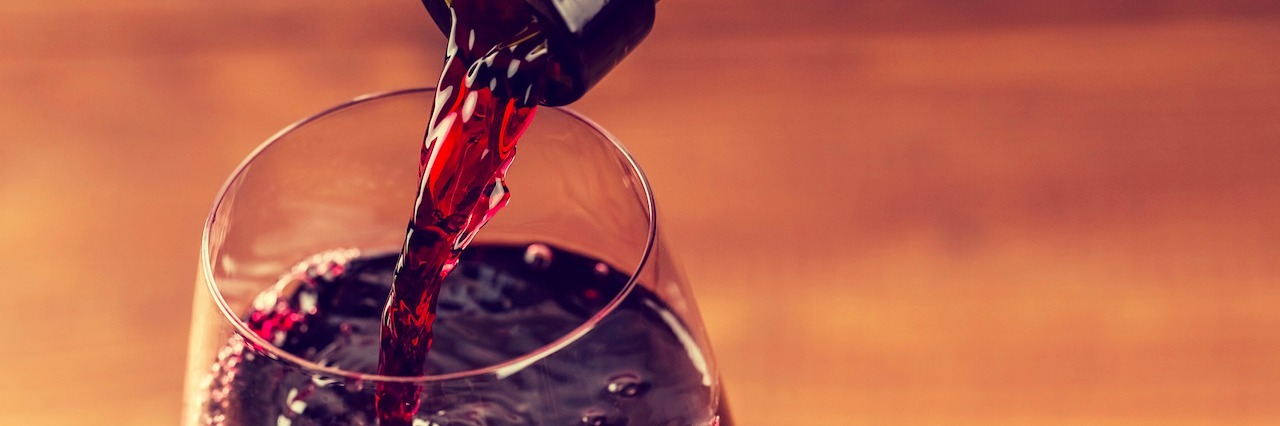 Why Memes About Moms and Wine Aren't Funny wine pouring into a glass