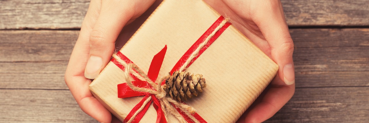 My Christmas Wish as a Person With Cerebral Palsy Holding a Christmas gift box.