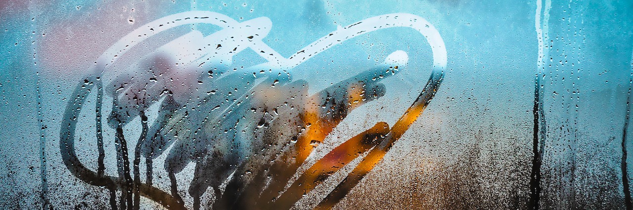 Borderline Personality Disorder: How to Forgive Yourself Heart drawing in the water droplets on a window.