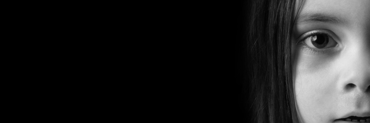 How Does Pain Change Me? A very straight portrait of a young child.Picture is black and white