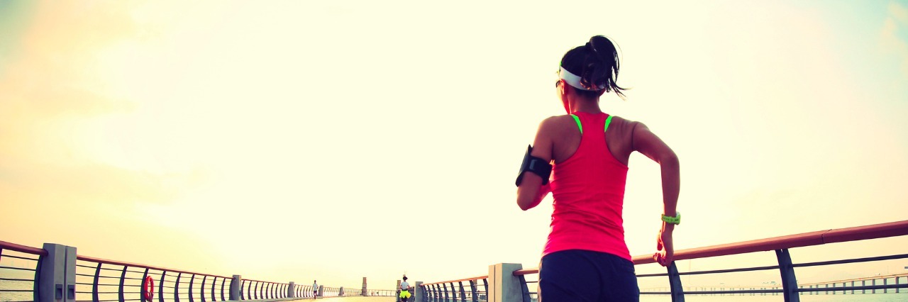 Letter to Stranger Who Saw Woman's Self-Harm Scars woman running on pier at seaside