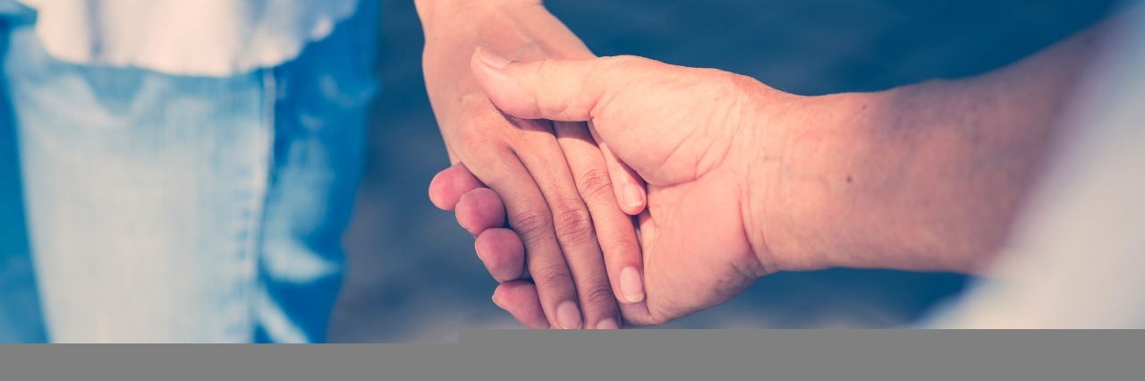 How to Love Someone With Social Anxiety close up of man holding womans hand
