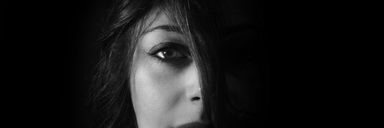 In a Depressive Episode: I Wish Others Could See I'm Trying portrait of a woman with a black background