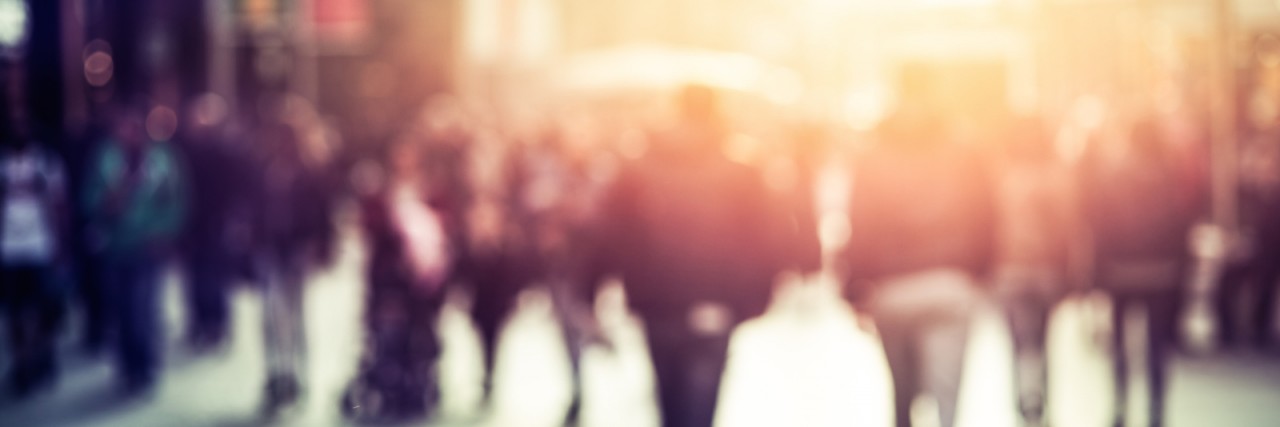 Understanding Myself and My Childhood After My Autism Diagnosis Blurry photo of people walking in the street