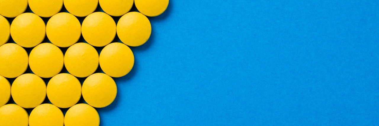 Frame of yellow pills