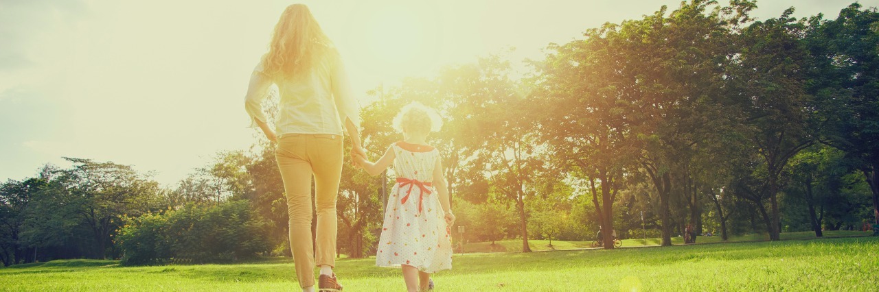 What I Want People to Understand About Being a Mom With Fibromyalgia Mum and daughter outside in the park