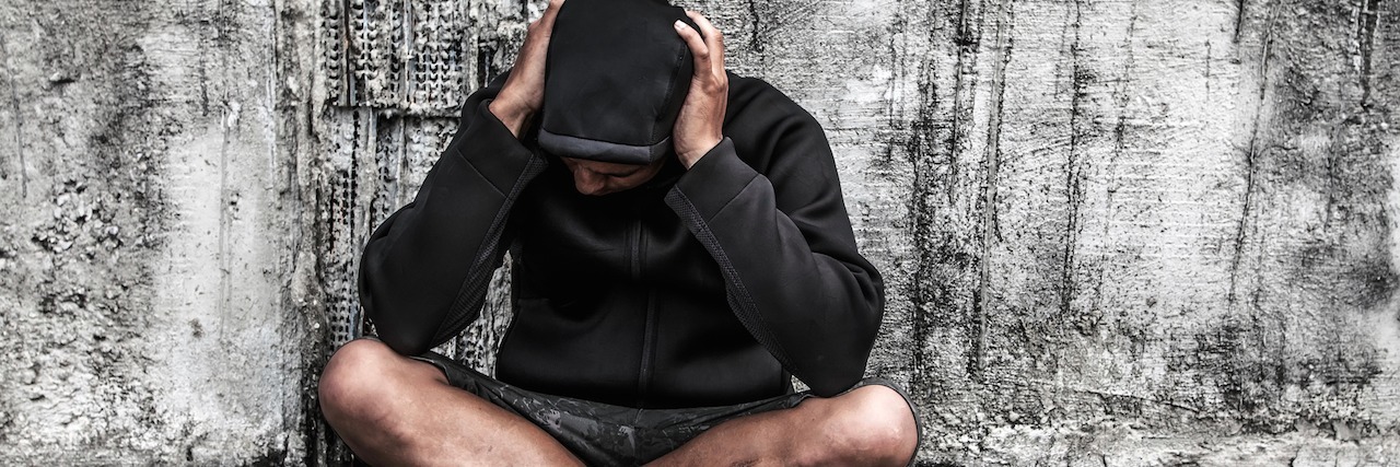 Bipolar Disorder: What I Need When I Isolate Myself man sitting down alone