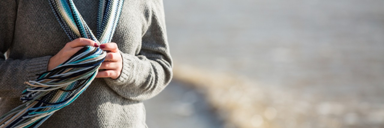 What It Feels Like When I Don't Know Why I'm Anxious Woman walking on beach shore, holding scarf she's wearing