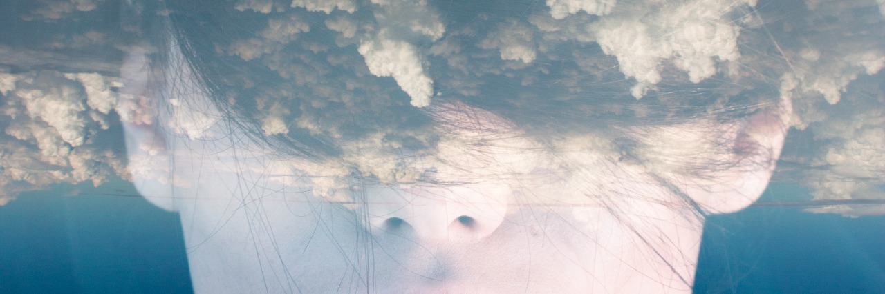 Finding a New Normal With Mental Illness After Trauma and Divorce Double exposure portrait of woman with clouds on her head