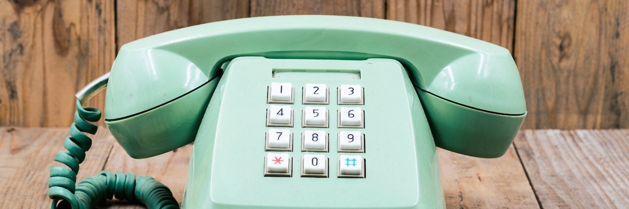 Suicide: When You Are Struggling to Ask for Help telephone on a wooden floor