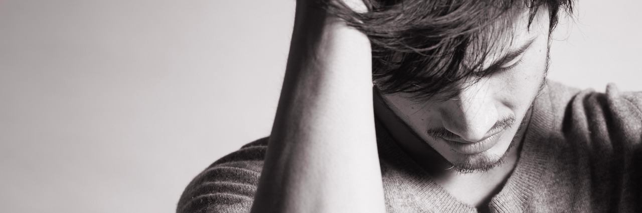 Ways to Reduce Your Anxiety man looking down