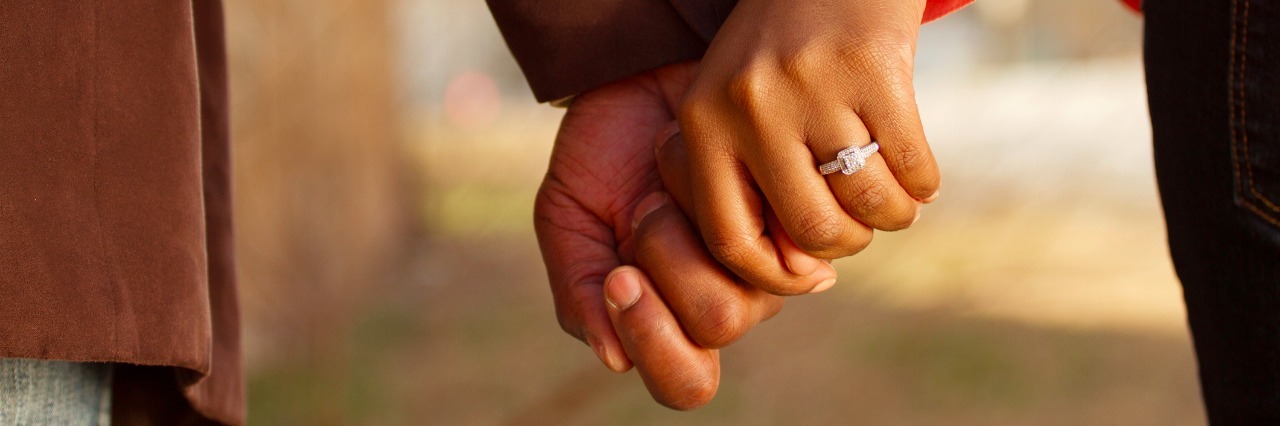 When You and Your Partner Both Live With Mental Illness close up of couple holding hands