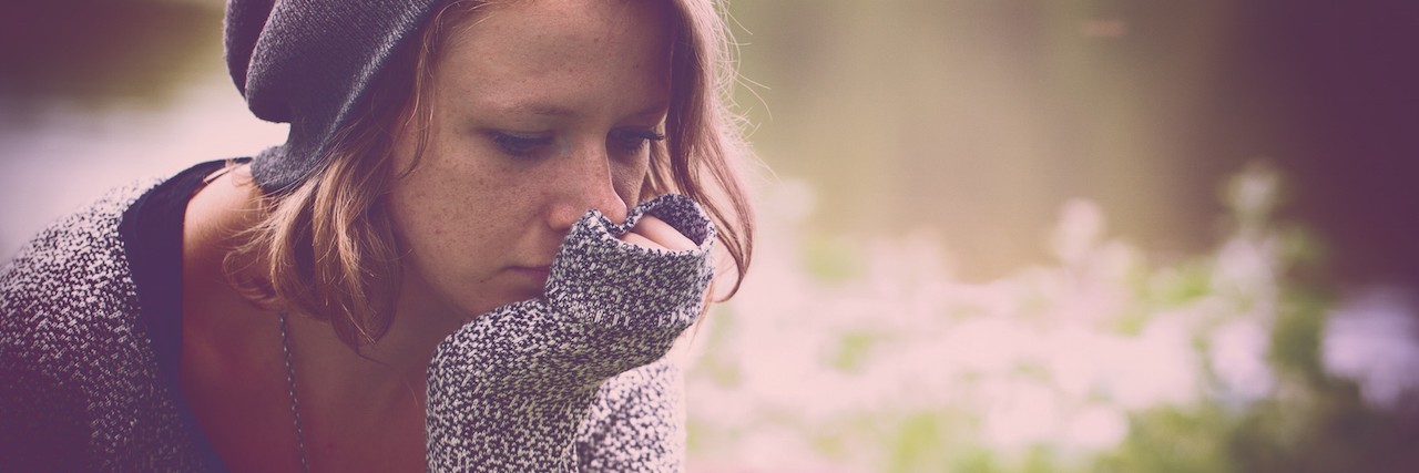Letter to Friends Who Left Because of Mental Illness woman sitting by the water