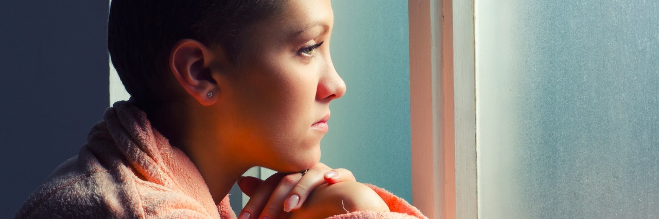 young patient looking out hospital window