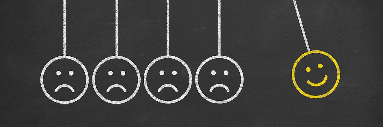 Mental Illness: Difficulty Processing and Reading Emotions A line of frowning faces next to a smiling face