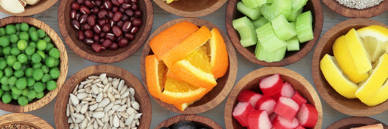 Effects of Vegetarian Diet for My Adult-Onset Myotonic Dystrophy Super food diet selection in wooden bowls.