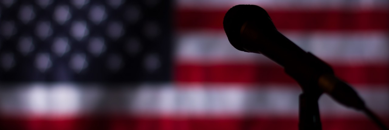People With Mental Illnesses Matter on This Historic Election Day USA flag in the darkness.