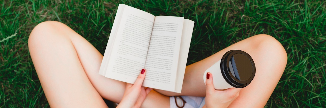 A Letter to Anxiety: What Having Anxiety Teaches You A girl sitting with a book and a cup of coffee