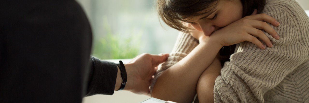 doctor comforting his patient