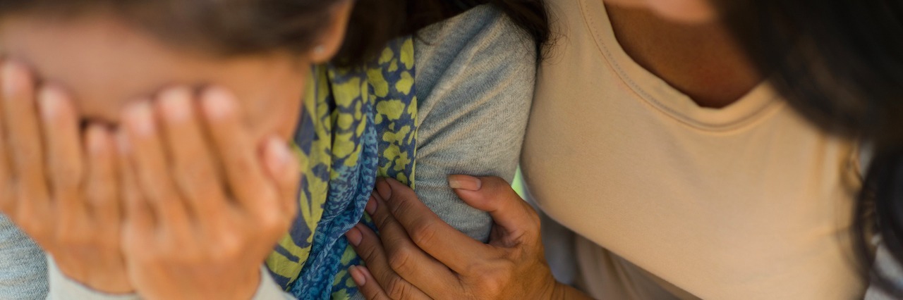 Don't Want to Talk to People About Depression A woman comforting her sad friend