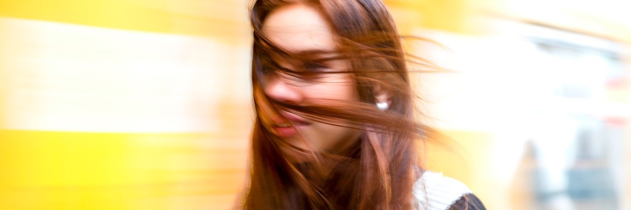 woman with her hair being blown by the wind
