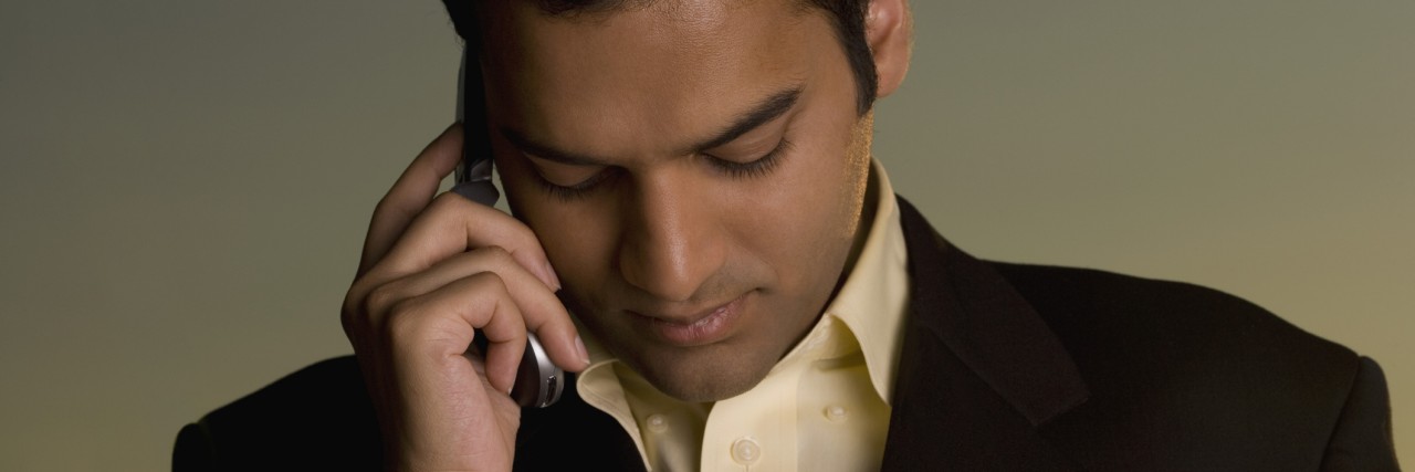 Response to 'It Gives Me OCD' Young man talking on a mobile phone