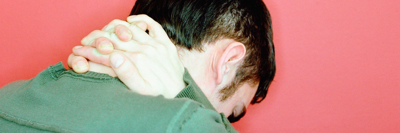 How My Uncle's Suicide Changed My View on Mental Illness man looking sad, his face down