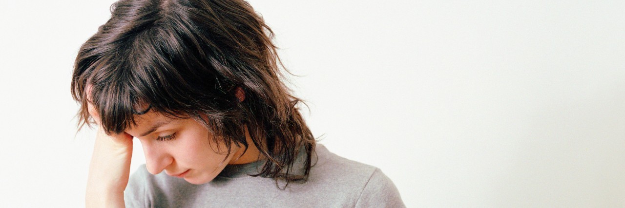 Chronic Pain and Responding to People Saying Someone Else Has It Worse Sad woman.