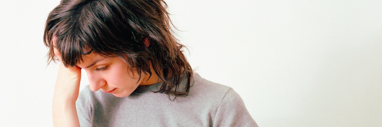 How to Know If a Friend With Depression Is Actually 'OK' Like They Say Worried looking woman