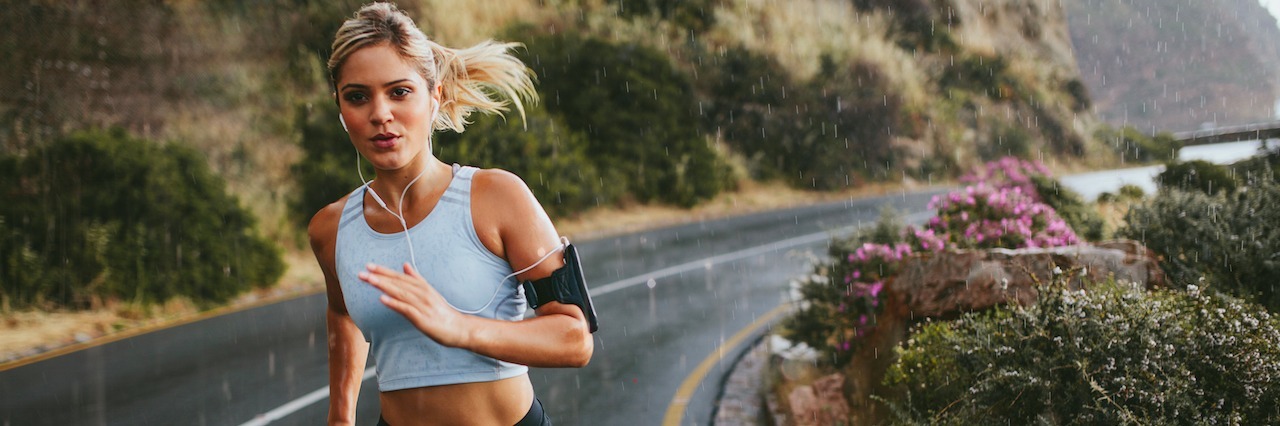 woman running in the rain