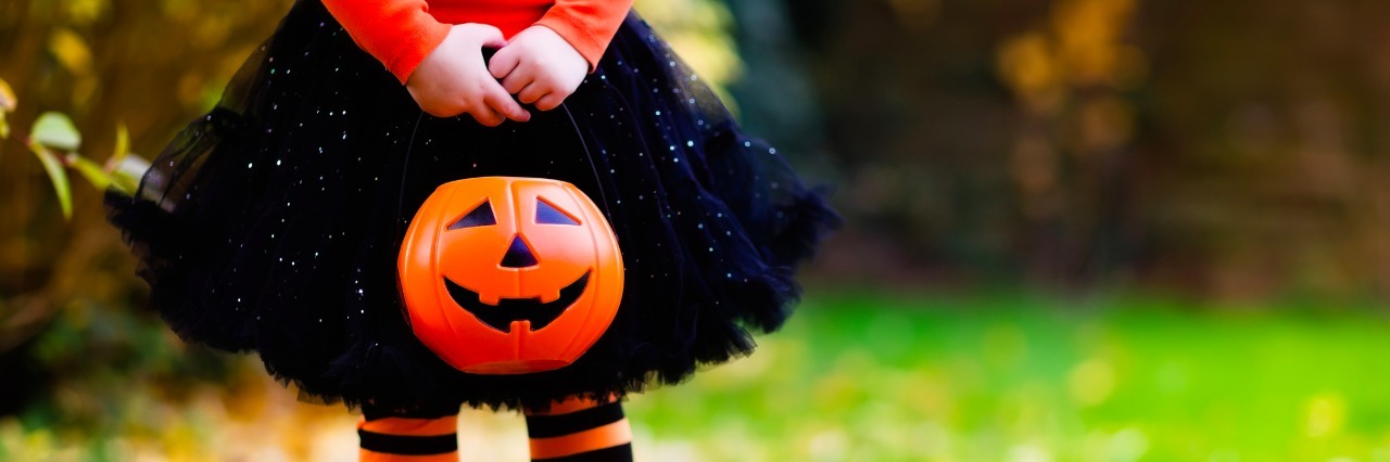 girl dressed in halloween outfit