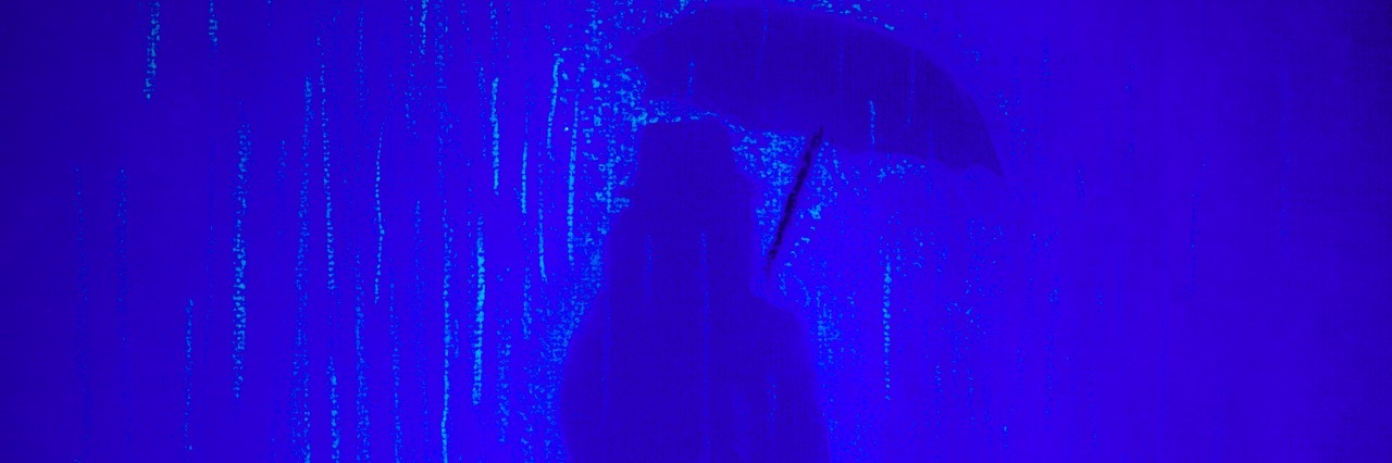 Major Depressive Disorder: Being Scared to Talk About My Feelings Silhouette of woman holding umbrella in the rain