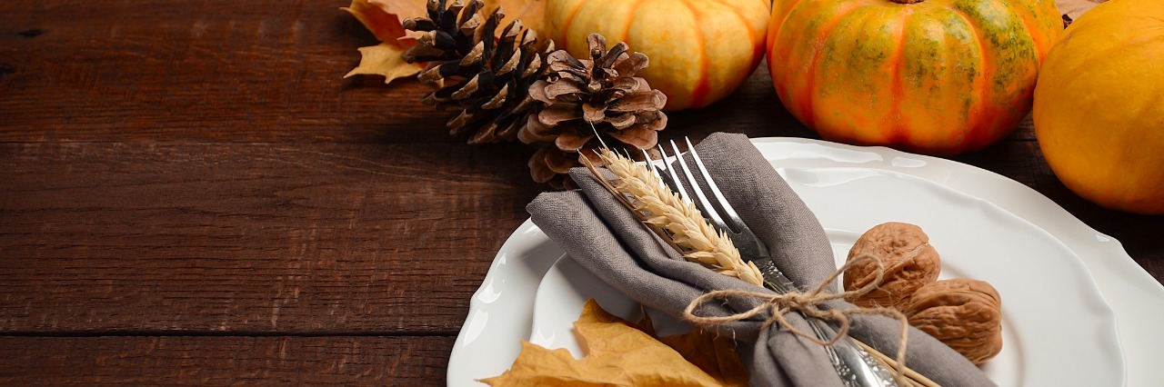 a single autumn themed table setting and fall table decorations
