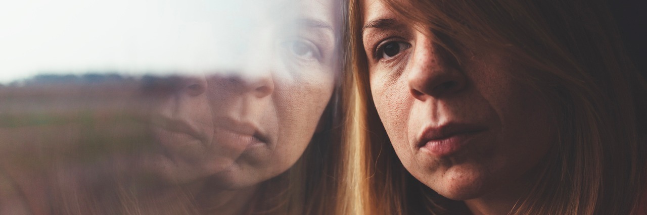 When Depression Makes You Unreliable woman looking out a window