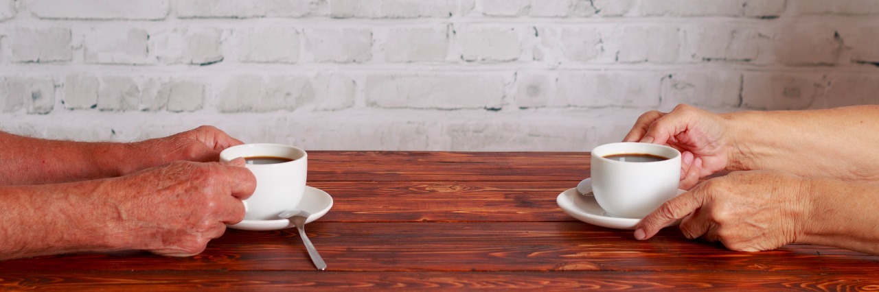 Stranger Opens Up About Psychiatric Past Over Coffee couple sitting in cafe and drinking coffee