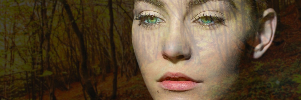 A Letter to My Past Self About Self-Acceptance A woman looking into the woods