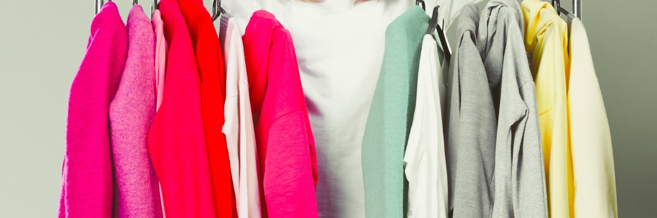 Woman Starts Clothing Company for People With Chronic Pain Woman choosing clothes to wear in mall or wardrobe