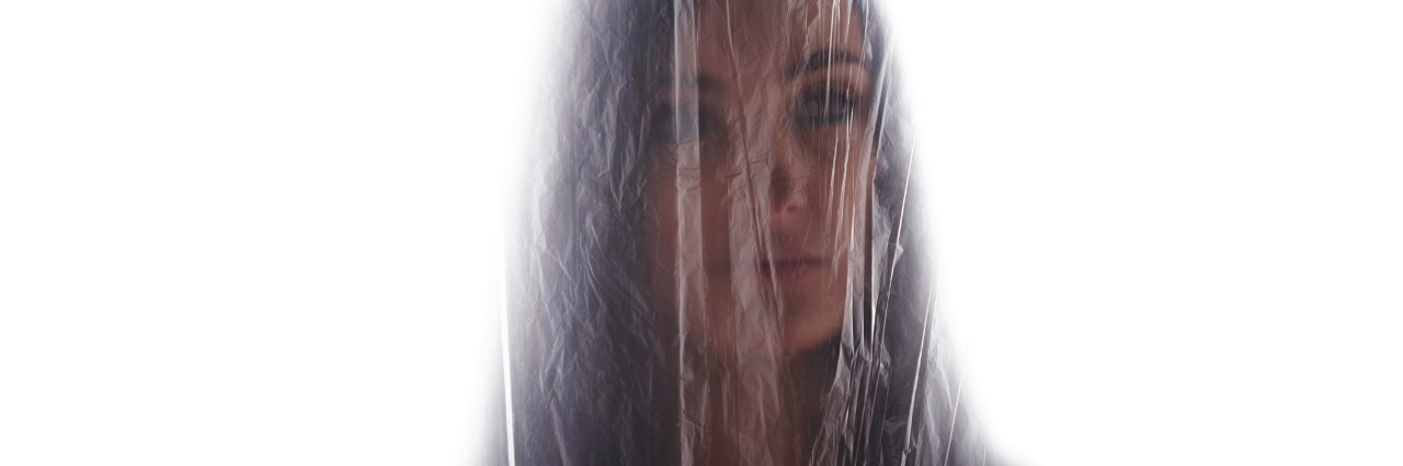 Mental Illness: When You Don't Know What You Are Feeling woman behind glass