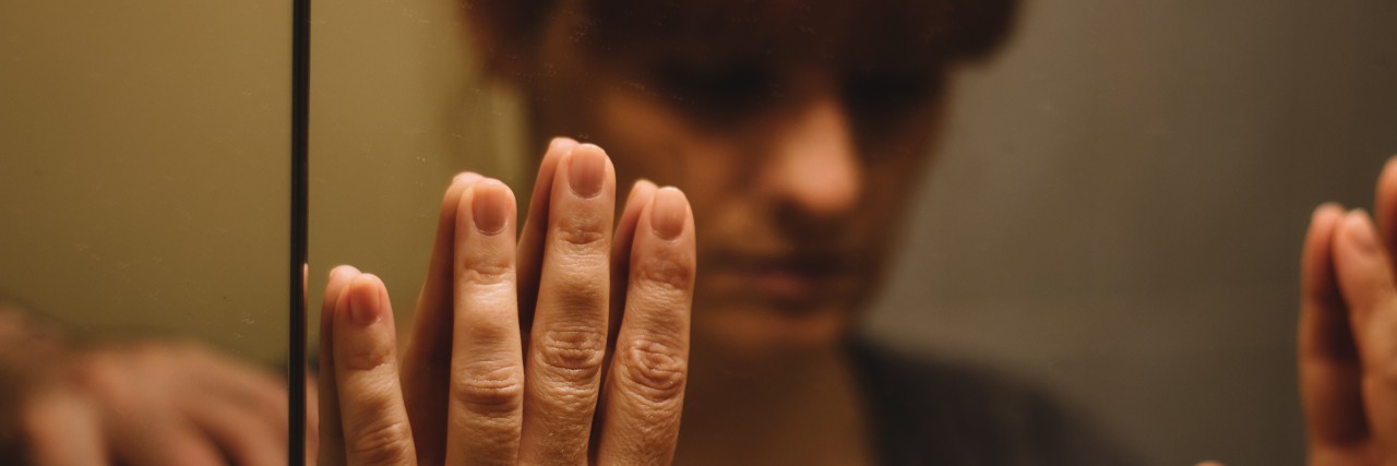 Why I Didn't Kill Myself Mirror reflection of sad, depressed woman