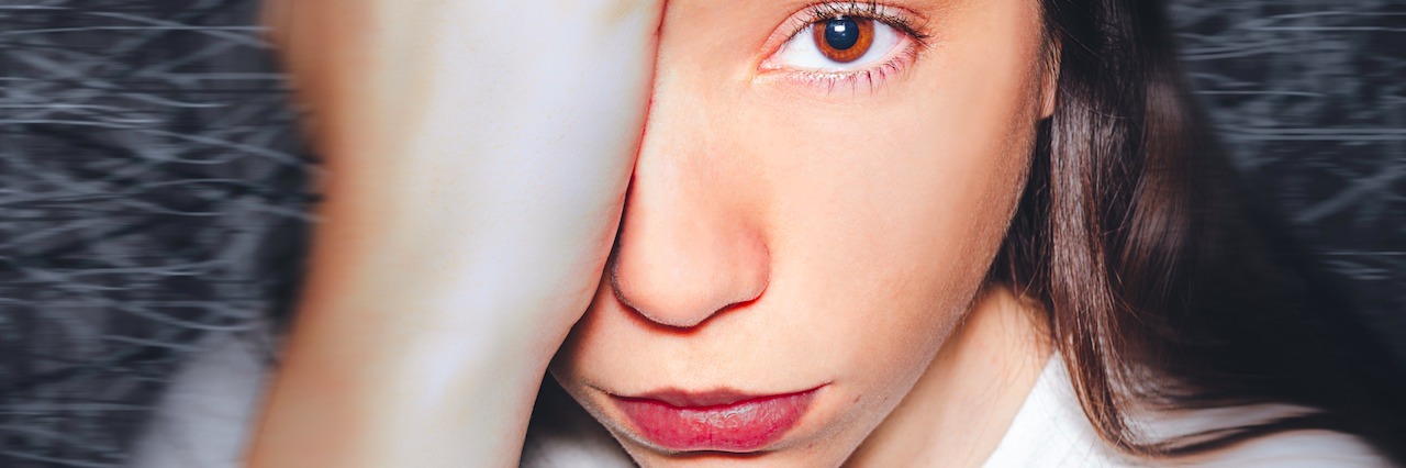 I Tried to Kill Myself woman looking straight with her hand on her head