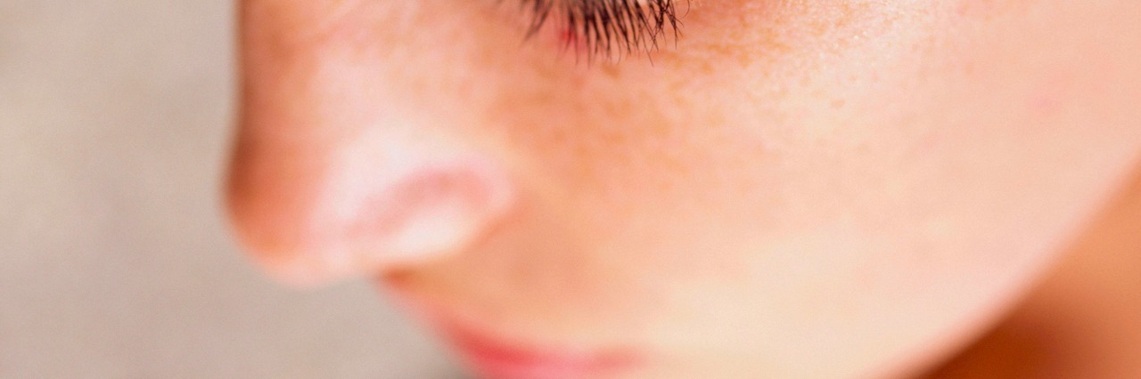 close up of a woman with her eyes closed