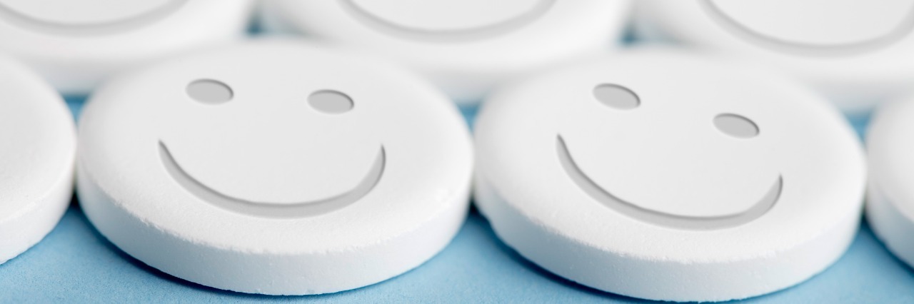 pills with smiley faces on them