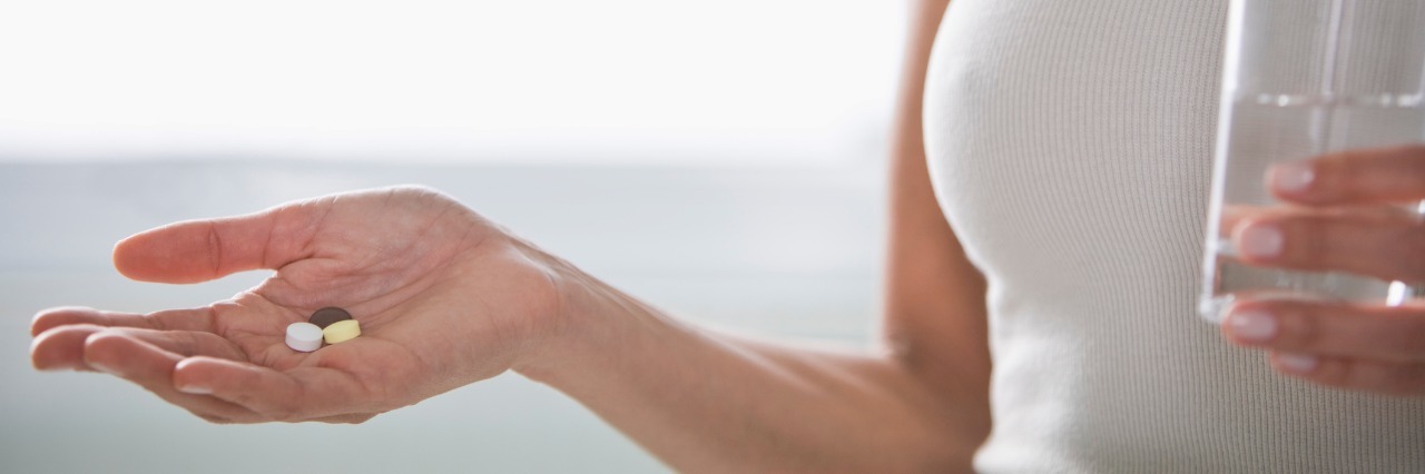 What to Do When You Are on the Wrong Psychiatric Medication Woman holding pills