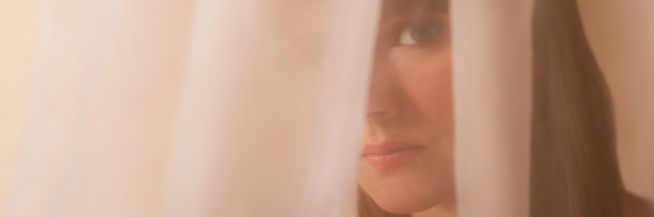 What You Can't See About Depression Woman behind a veil