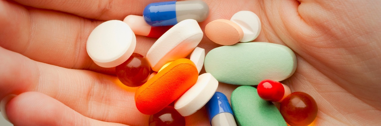 Bipolar Disorder: When Your Medication Starts Working pills on a persons palm